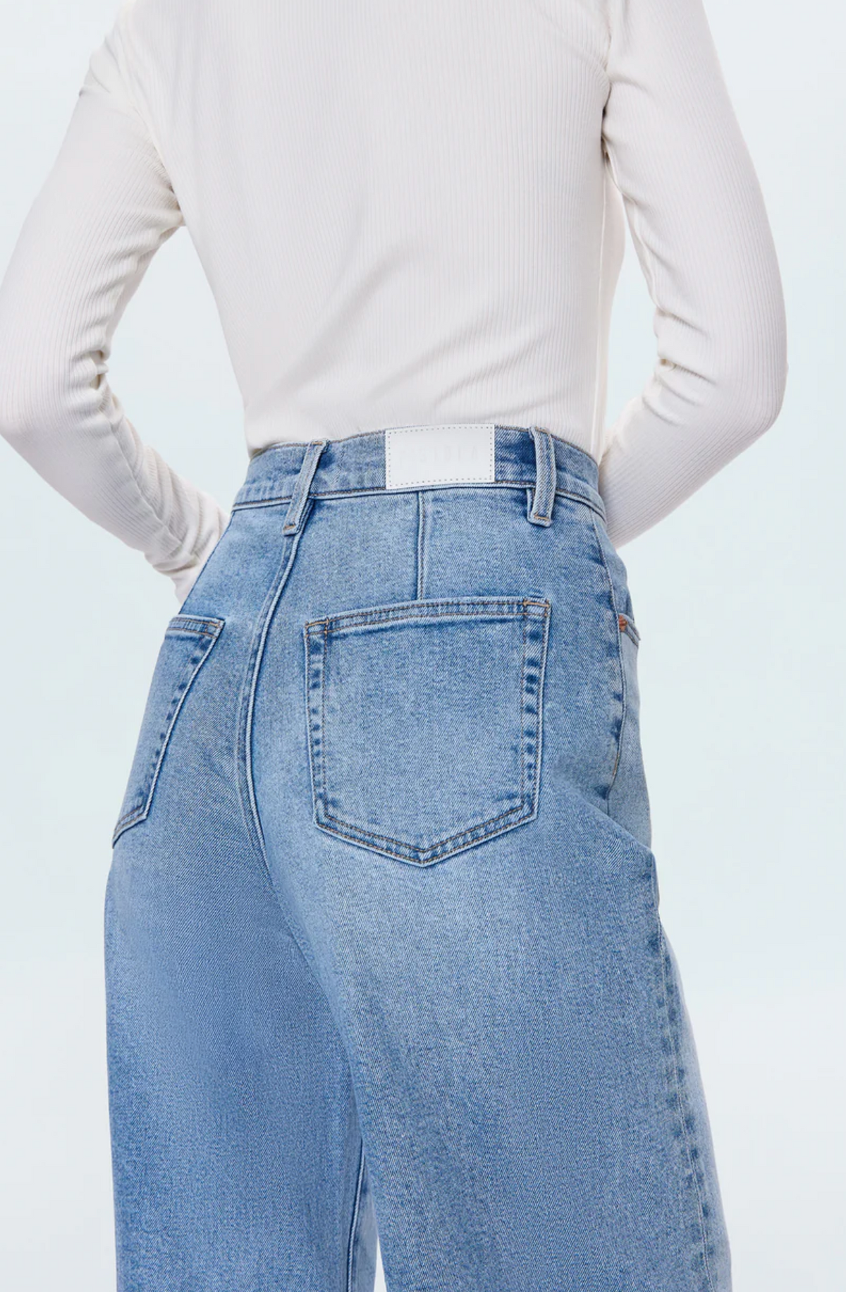 KYRA HIGH RISE BOWED ANKLE JEAN